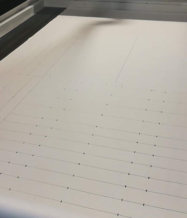 A cut path marked out on a foam sheet on the cutting table